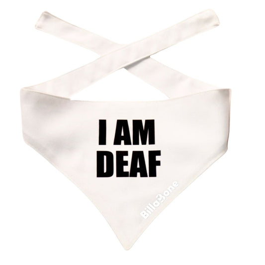 A white polyester bandana with bold black text that reads “I am Deaf”. Designed for dogs that may not respond to sounds due to hearing impairment. Featuring a reflective Billabone logo for visibility, this lightweight and breathable white bandana helps others approach with care and understanding. The color white is universally recognized for the aforementioned terminology.