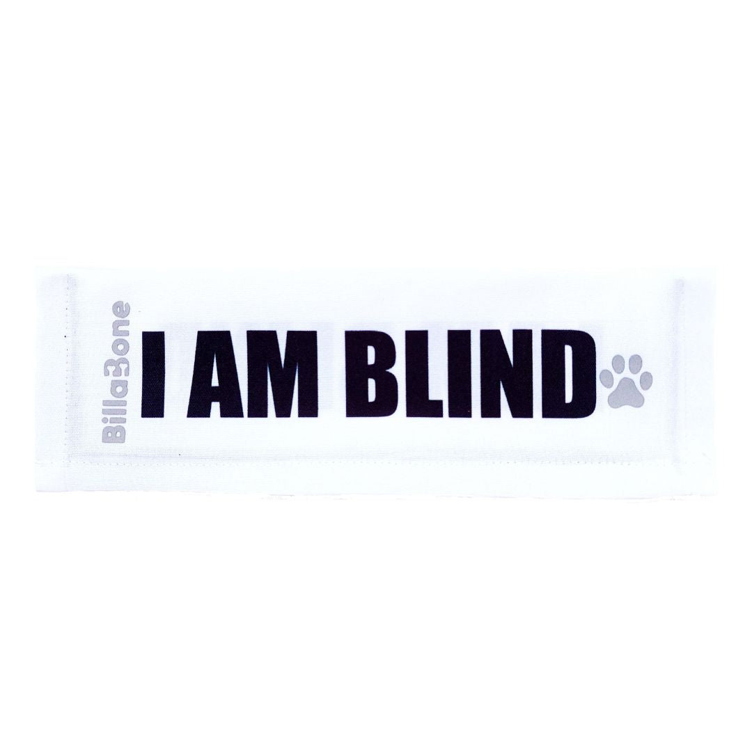 A white lead cover with bold black text that reads "I AM BLIND". This cover for leads or leashes are designed to help pet owners signal to others that their dog is blind.